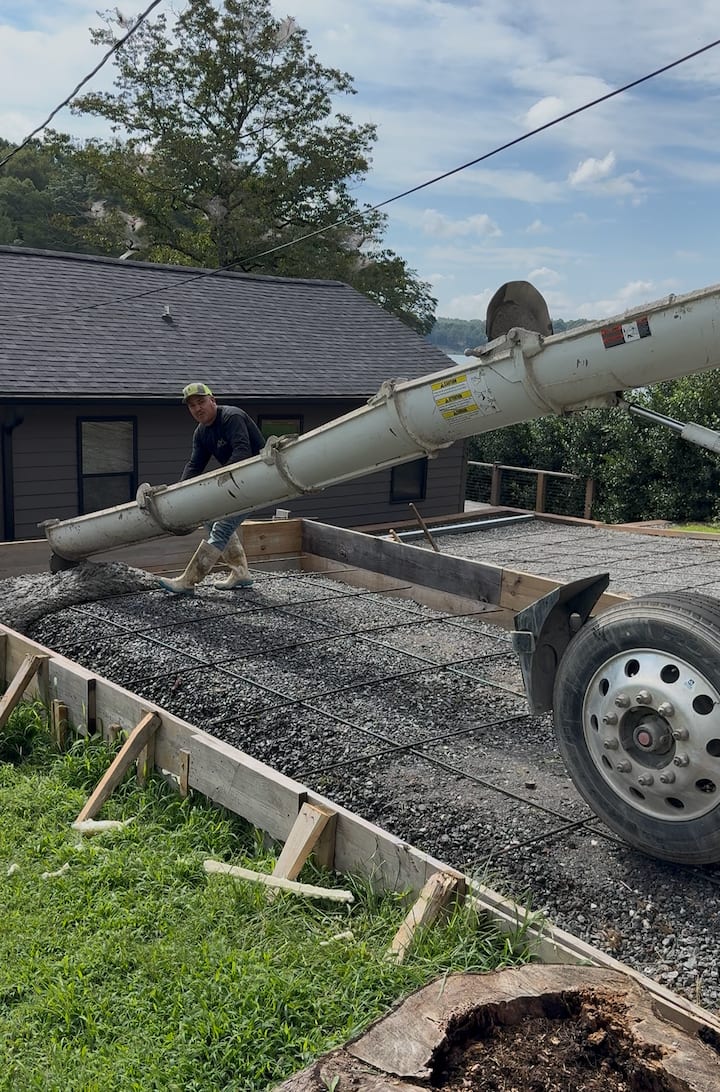Before photo of a concrete restoration job in Charlotte, NC (Mecklenburg County) by Local Driveway Co — failed slab, surface spalling, and structural cracking documented prior to full demolition and replacement with 4000 PSI mix and #4 rebar.