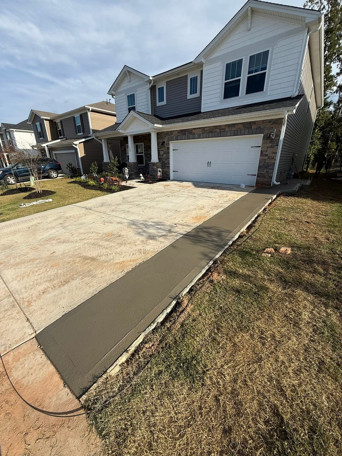 Premium Concrete Driveway Extensions services in Charlotte, NC (Mecklenburg County) by Local Driveway Co — engineered mix design, structural reinforcement, free written estimate same day.