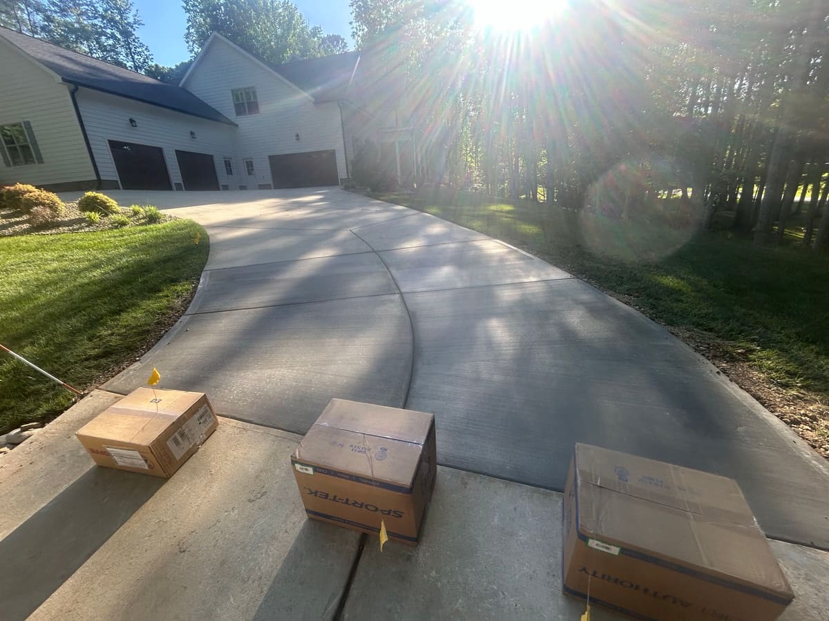Professional Concrete Driveway Repair installation in Charlotte, North Carolina by Local Driveway Co — commercial-grade base prep, 6-inch compacted aggregate, expansion joints sawn within 12 hours.